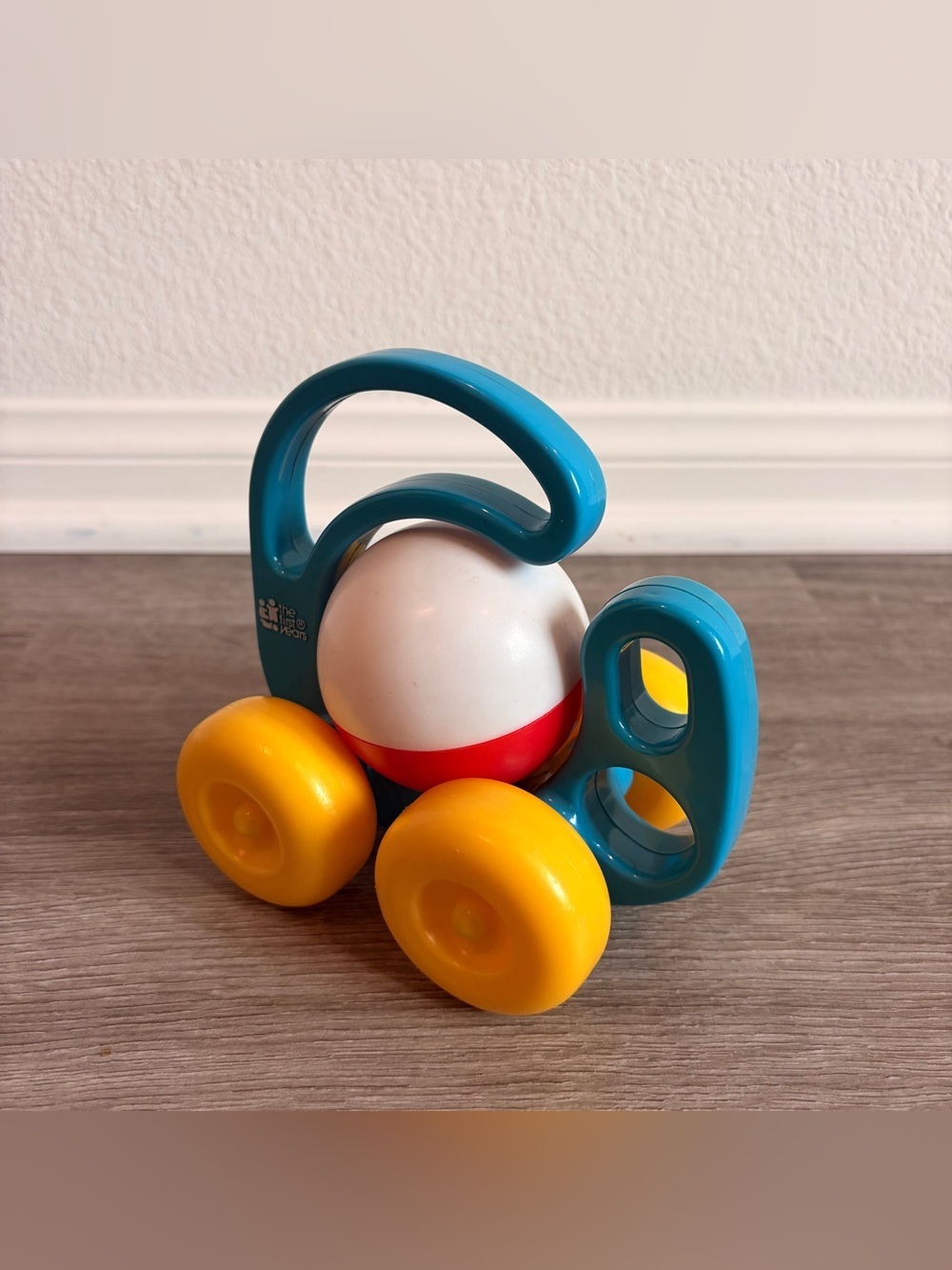 The First Years vintage wheel around roller car toy